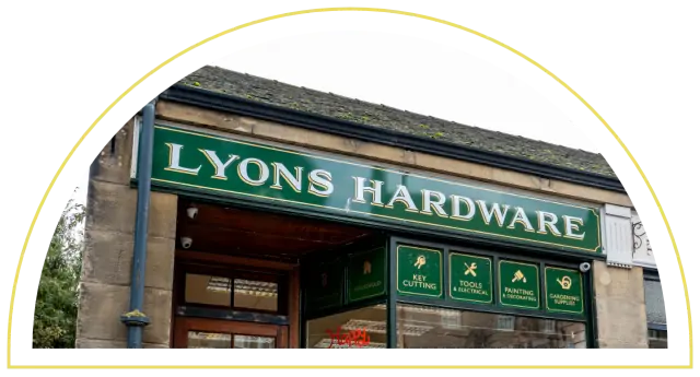 The green Lyons Hardware shop sign above the door and window, South Street, Bo'ness